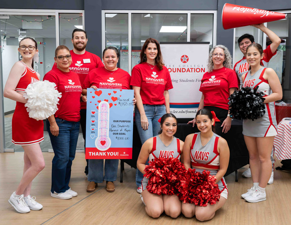 Members of the Lee College cheer team and Foundation hold a megaphone, t-shirt, pompons, and a progress chart.